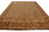 Angled perspective on a gold wash Indian carpet showing the high luster across its allover floral design.