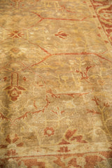 A low-angle view showing the high luster and soft pile of a gold wash Oushak design carpet.