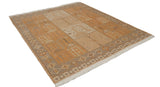 Corner of Indian Soumac rug, soft beige and orange pictorial motifs, white fringe.