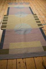Contemporary Kilim runner with abstract mauve, beige, and blue interlocking blocks.