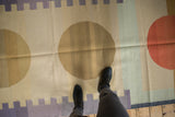 Contemporary Kilim runner's abstract geometric circles in sand, lilac, and pale blue.