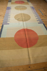 Abstract geometric hand woven Kilim runner section with rust red and beige circles.