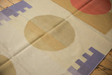 Hand woven Kilim runner detail showing beige field and lilac geometric block pattern.