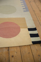 Contemporary kilim rug detail: madder root red circle, saffron gold block, and black striped edge.