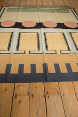 Vintage Contemporary Kilim rug's abstract dark navy track trails and sand colored comb patterns.