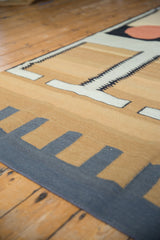 Contemporary Kilim carpet with abstract sand, charcoal, white geometric track trails and red circle.