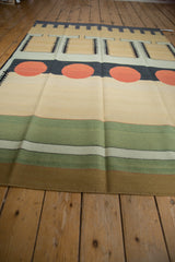 Vintage Contemporary Kilim rug with green stripes, subtle abrashes, and solid bronze edge.