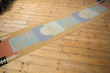 Pinwheel coloration and juxtaposed geometric circles and squares in powder blue and sand.