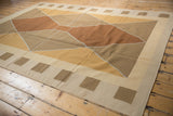 Detail of hand-woven contemporary kilim with copper and beige geometric diamond and square motifs.