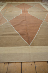 Contemporary hand woven Kilim with argyle-inspired copper and sand diamond pattern and ivory lines.