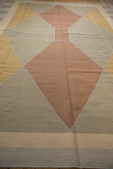 Hand woven contemporary kilim, Argyle-inspired diamond pattern in copper and beige.