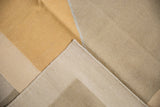 Contemporary Kilim rug's folded corner, highlighting copper front, beige reverse, and secure selvage.