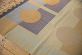 Vintage contemporary kilim with a pale blue geometric zipper design and neutral blocks.