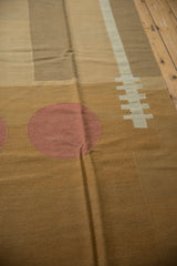 Pale cochineal red circle and ivory stripe within rectangular shapes on a contemporary Kilim.