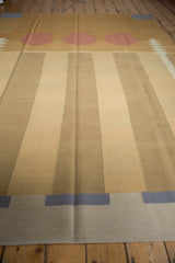 Abstract design detail showing beige kilim edge with dusty navy blue block.