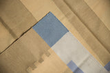 Contemporary kilim flatweave featuring beige, gold, dusty blue blocks and original side selvage.