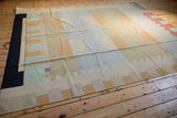 Abstract geometric motifs and circles in beige, pale red, and mint green on a Contemporary Kilim.