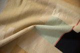 Contemporary hand-woven kilim texture in beige, pale mint green, black, and raspberry.