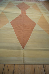 Modern hand woven kilim texture in subtle beige and sand tones, zig-zag edges.