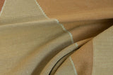 Modern flat-woven kilim rug texture in copper and deep sand shades.