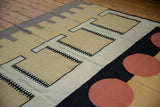 Vibrant madder root red circles, black bands, and beige geometric motifs on the kilim.