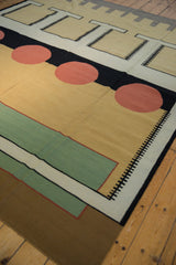 Vintage contemporary Kilim rug displaying abstract geometric brown, green, red, and black pattern.