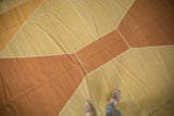 Soft wool vintage kilim rug showcasing pale copper and beige diamond pattern with abrash.