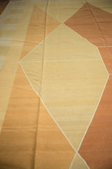 Contemporary Kilim rug detail showing soft wool texture, diamond pattern, and pale copper abrashes.