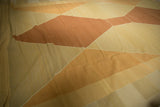 Geometric pale copper, beige, and gold abrash on soft contemporary Kilim flatweave wool.