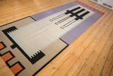 Contemporary Kilim rug detail: abstract interlocked border with beige, black, terracotta.