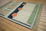 Abstract geometric design of the Contemporary Kilim in charcoal, pale coffee, and emerald green.