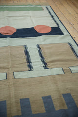 Abstract geometric kilim design featuring charcoal, silver, and pale coffee brown bands.