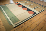 Contemporary kilim with abstract geometric coffee brown, ivory, and charcoal navy blocks.