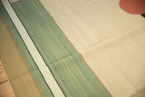 Interlocked geometric stripes in pale mallard green, ivory, and coffee brown on contemporary Kilim.