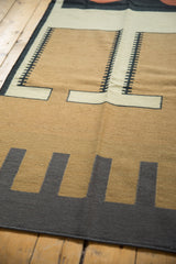 Hand woven kilim texture with interlocking coffee brown, ivory, and charcoal design.