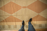 Modern Argyle diamond pattern hand woven kilim in pale copper and beige.