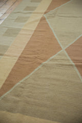 Modern Argyle geometric pattern on a vintage hand woven kilim in copper, beige, and sand.