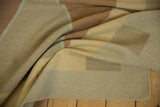 Contemporary Kilim rug edge showing beige and copper flat-woven texture and intact selvage.