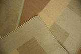 Hand-woven contemporary Kilim rug corner with beige, sand, copper flatweave and intact selvage.