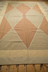 Hand woven contemporary Kilim showing pale copper and beige diamond motif.