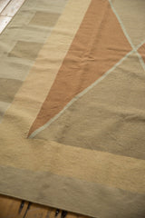 Contemporary Kilim carpet texture, argyle diamond pattern in pale copper and sand tones.