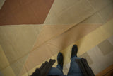 Contemporary Kilim with hand woven texture, showing dark copper and beige geometric pattern.