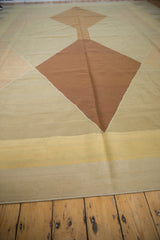 Argyle-inspired diamond pattern in copper, beige, and saffron on this contemporary Kilim rug.