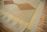 Side view of this modern geometric kilim with original side cord selvage and neutral tones.