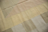 Flatweave detail of the contemporary Kilim, showcasing alternating beige and sand tones.
