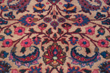 Vintage Meshed rug close-up with ornate palmettes, botehs, and vinery in red, indigo, and beige.