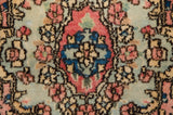 Fine Kerman rug's floral spray detail with dusty rose, sapphire blue, and pale sea foam green.