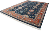 Indian Bijar carpet: dark denim blue field, terracotta border, full pile, and floral palmettes.