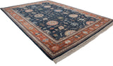 Large palmettes on dark denim blue field and terracotta border of a vintage Bijar carpet.