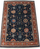 Corner of vintage Indian Bijar design carpet, showing terracotta border and dark blue palmette field.